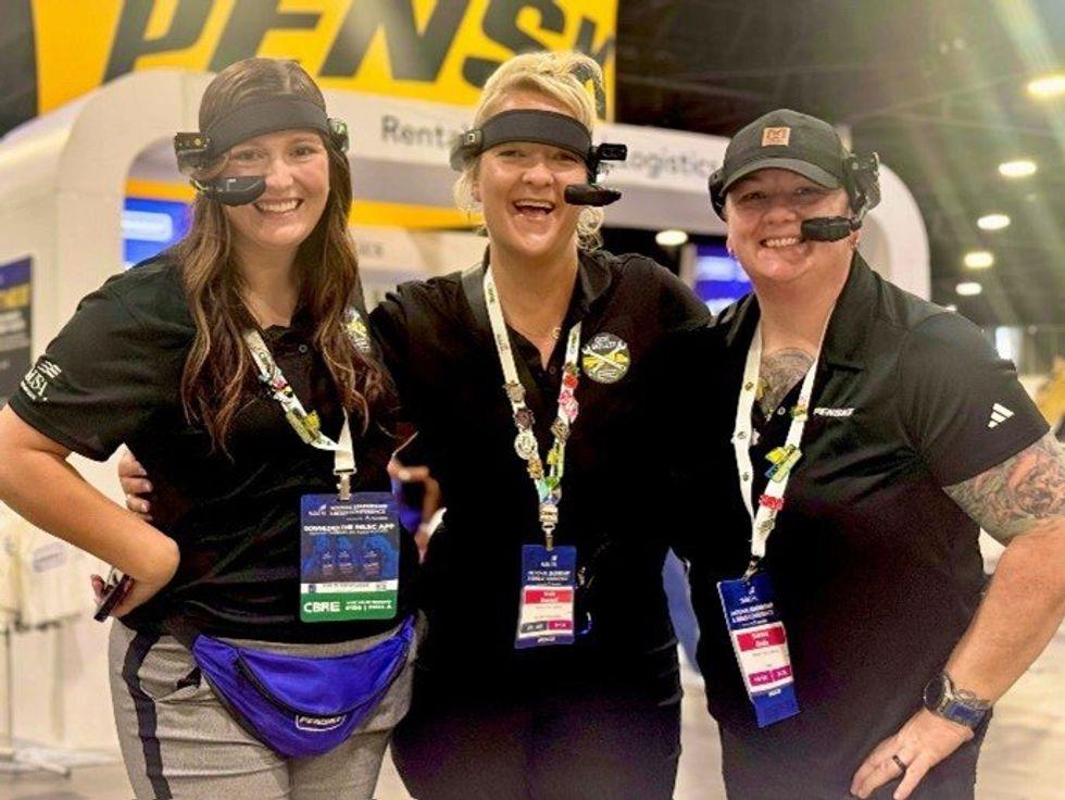three women wearing headsets