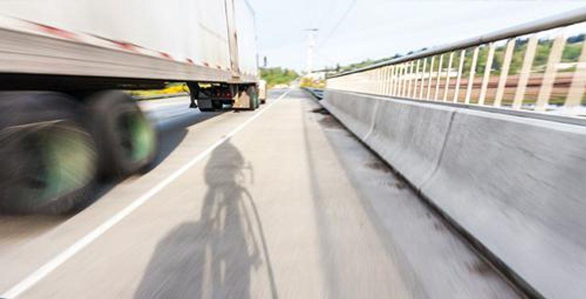truck driving on hot road in the summer