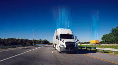 White truck driving down the highway